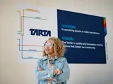 Woman in front of TARTA sign